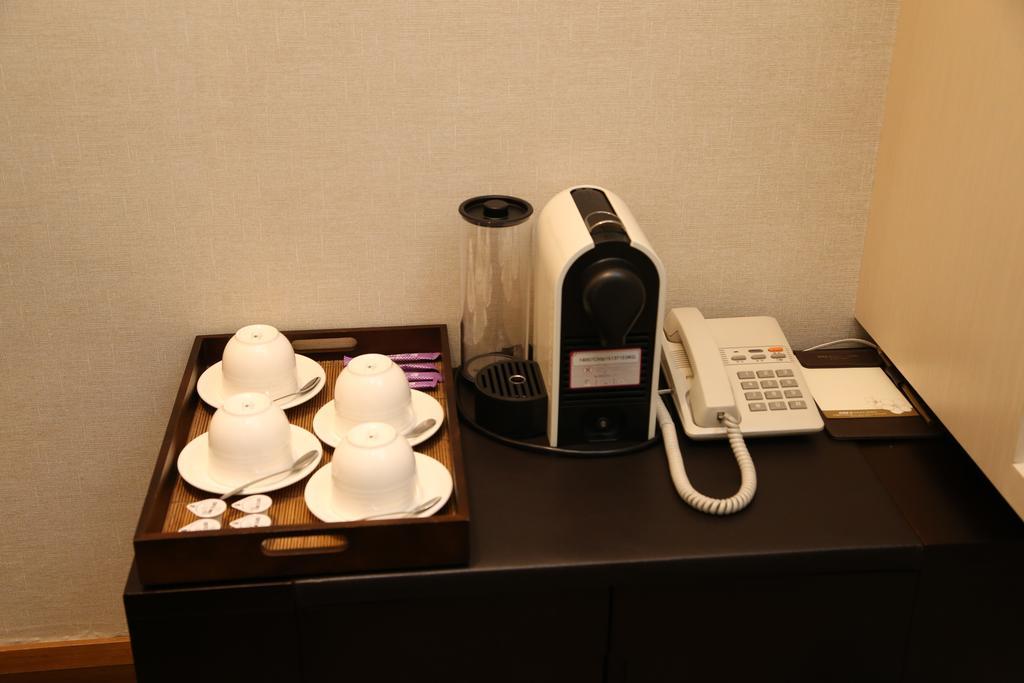 Nice Prince Hotel Chiayi City Exterior photo A Nespresso coffee machine in a hotel room
